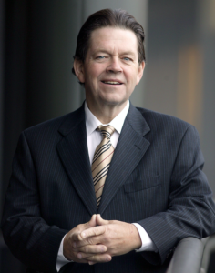 Arthur Laffer in a suit and tie